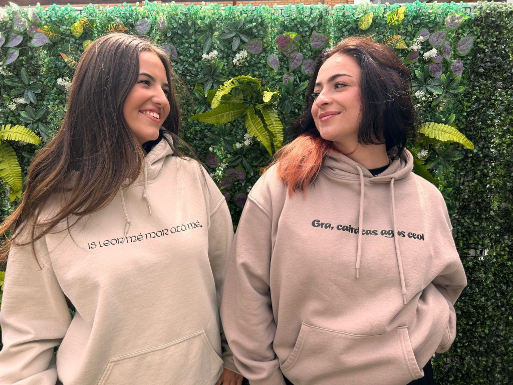 Gra Duit hoodie front text ivy wall shot