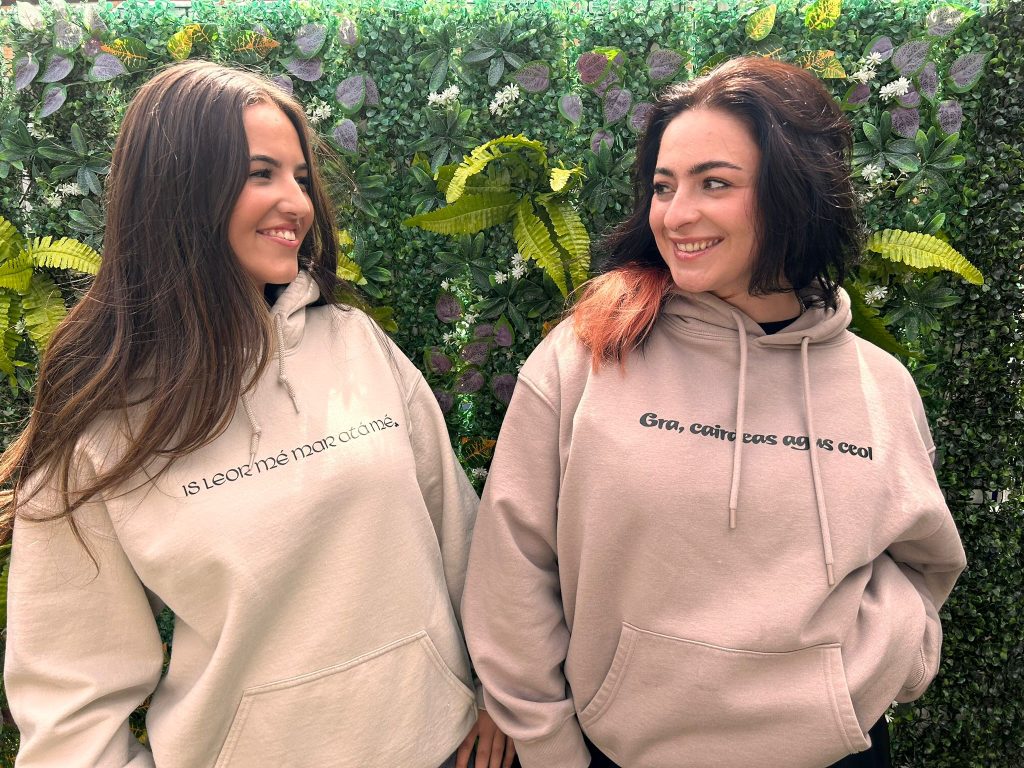 Grá Duit hoodies close ivy wall shot